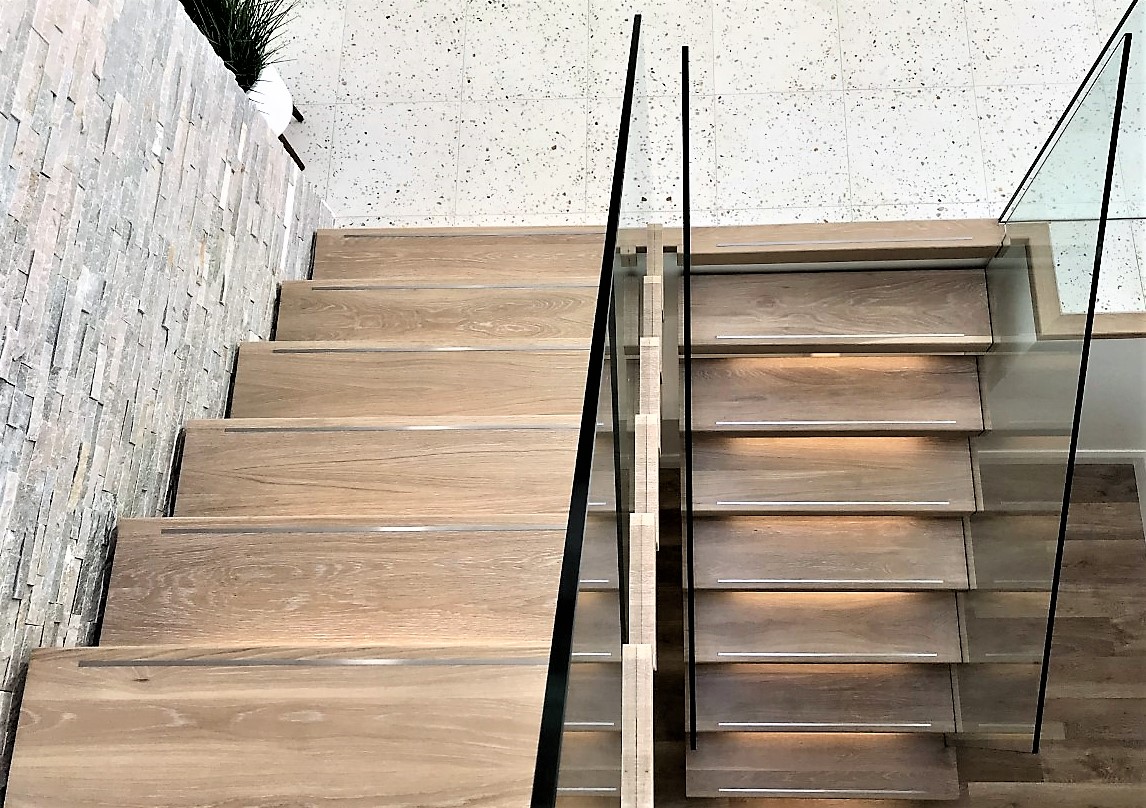 Steel spine stairs, limed European oak treads with stainless steel inlay Stairs Ireland